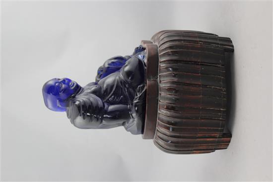 A Chinese Beijing blue glass seated figure of Budai, late 19th / early 20th century, total height 27cm, chip to Budais robes